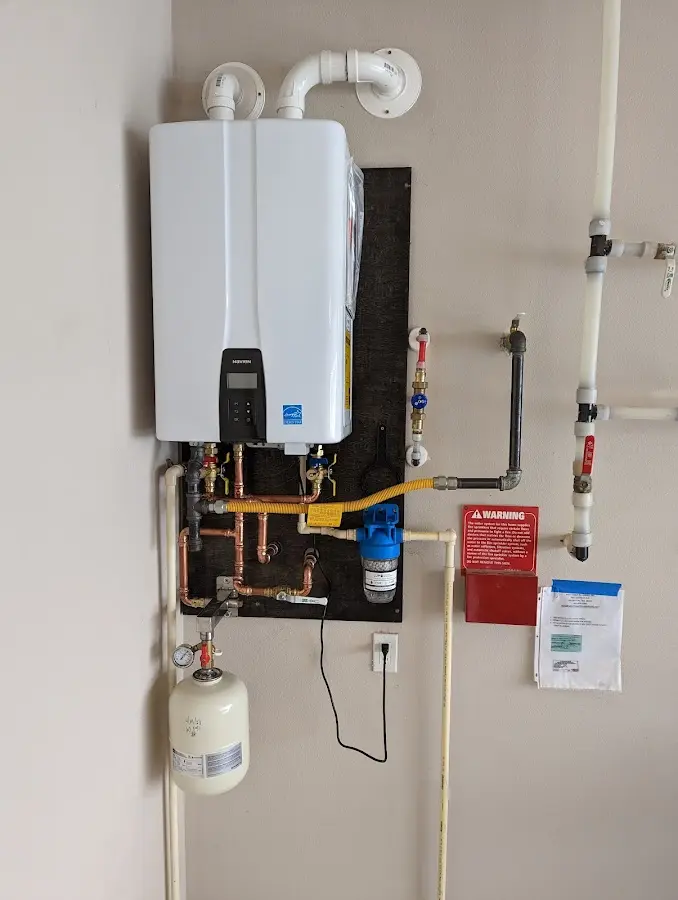 Professional plumber installing copper piping in a Glenn Heights home